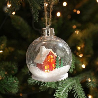 Glob pentru Bradul de Craciun LED, Flippy, Model A, Glob Transparent cu Figurina Casa si Braduti iluminat LED, Diametrul 10 cm, Baza Solida, Transparent Glob pentru Bradul de Craciun LED, Flippy, Model A, Glob Transparent cu Figurina Casa si Braduti iluminat LED, Diametrul 10 cm, Baza Solida, Transparent